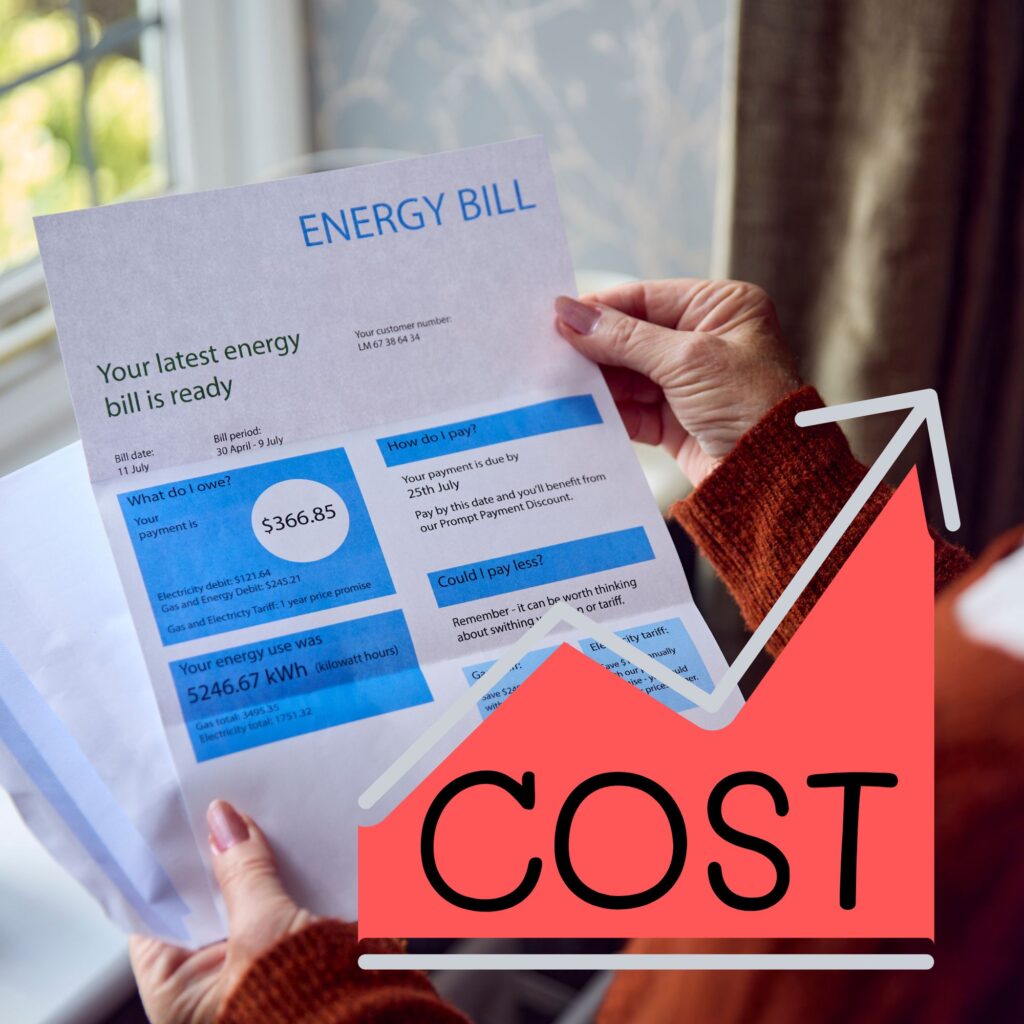 Hands holding energy bill with rising cost graphic.